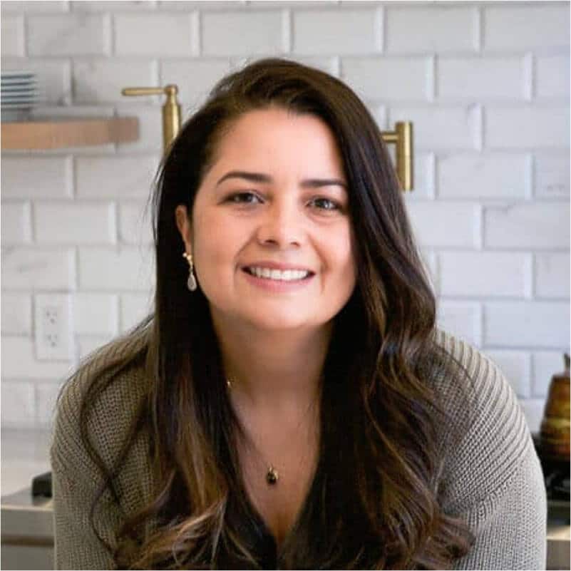 Photo of Olivia in her kitchen, founder of Primavera Kitchen